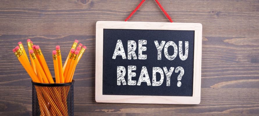 crisis communication plan image. Sign that says "Are you ready" beside a container of pencils.