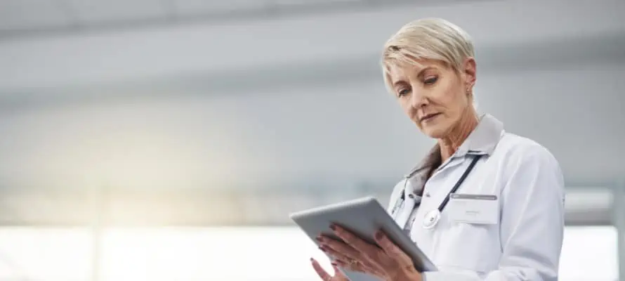 female doctor using an iPad