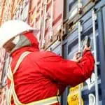 BNSF Logistics employee scanning a freight container