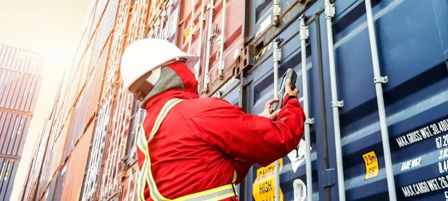 BNSF Logistics employee scanning a freight container