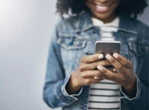 African American woman holding a smartphone