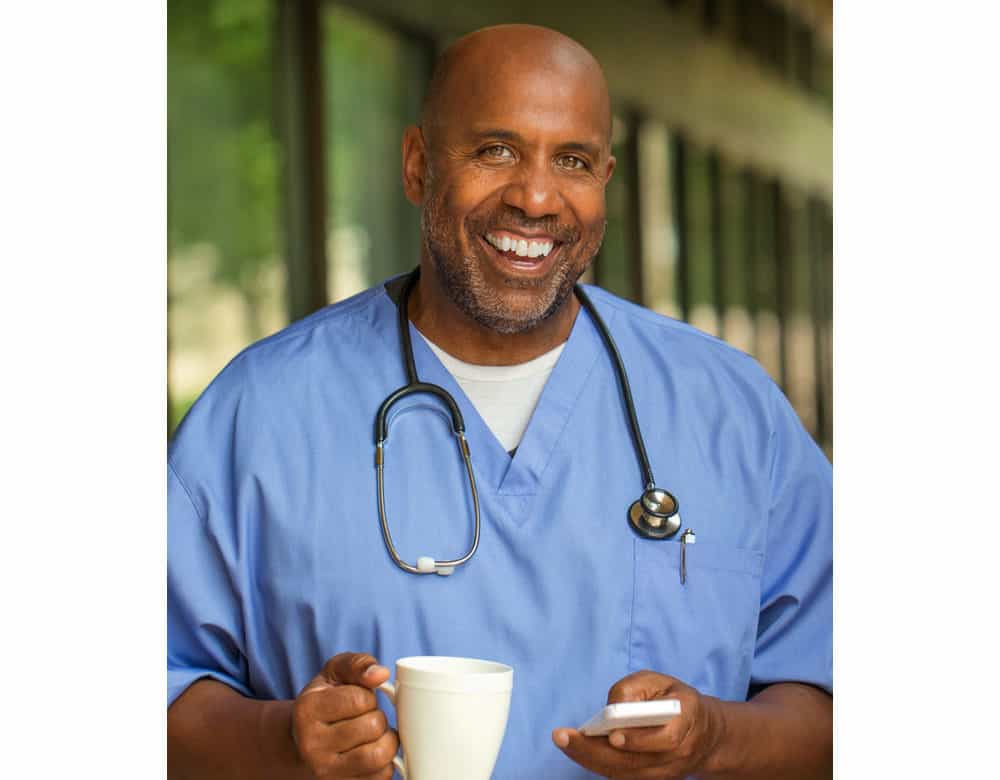 doctor holding mug and cellphone