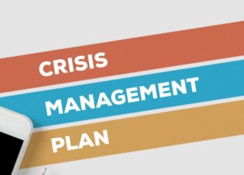 Graphic that says "crisis management plan" with a smartphone in the lower left side of the image.