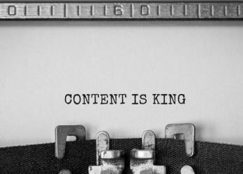 Typewriter spelling out "Content is King"