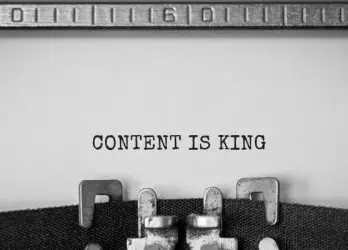 Typewriter spelling out "Content is King"