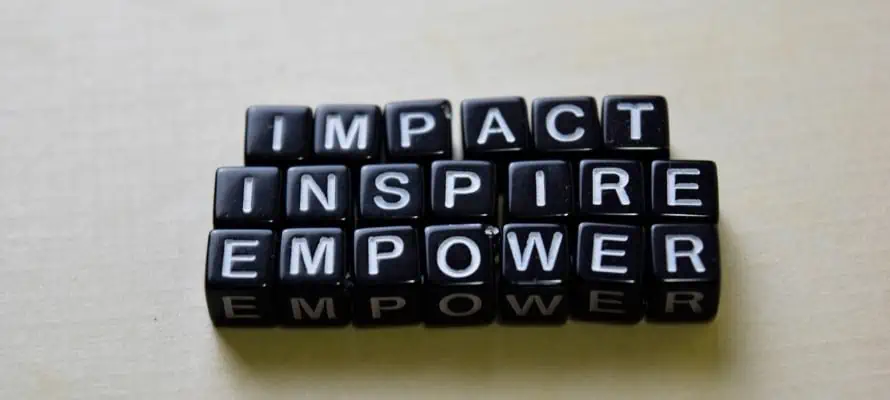 three words spelt in blocks: impact, inspire, empower