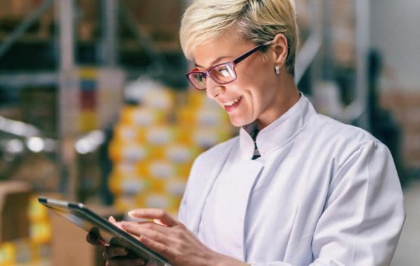 female line manager using a tablet