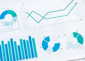 stack of papers with graphs and data visualizations on them