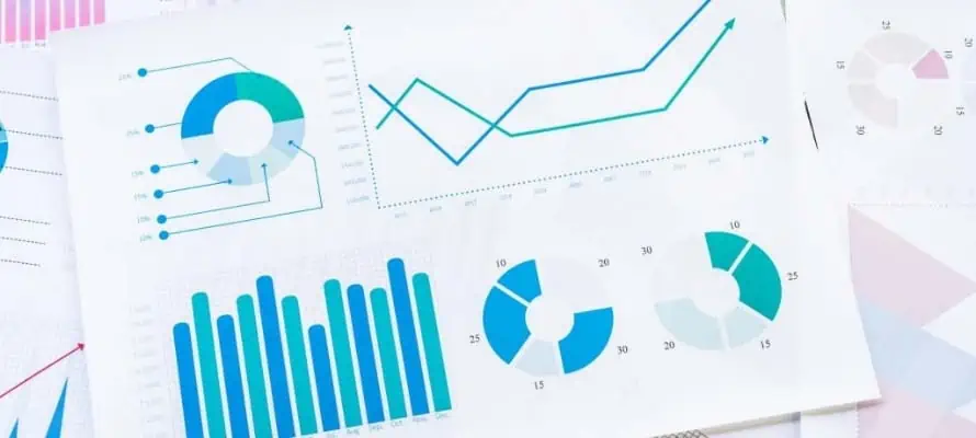 stack of papers with graphs and data visualizations on them