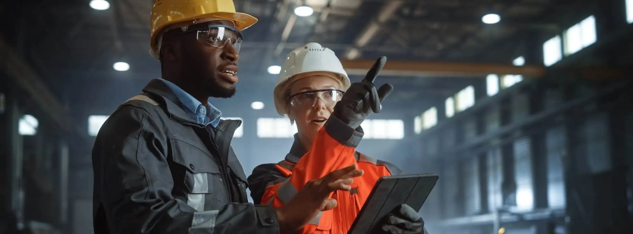 frontline workers using tablet on shop floor