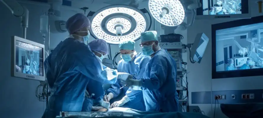 surgeons operating in a hospital operation room