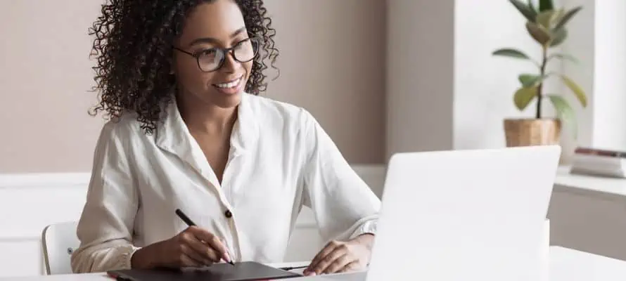 comms professional working on internal comms strategy on laptop