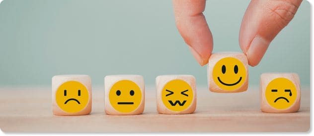 happiness rating with wooden blocks to depict employee experience