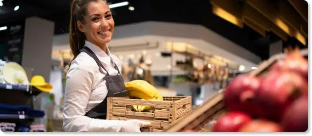 engaged happy employee working in a grocery store