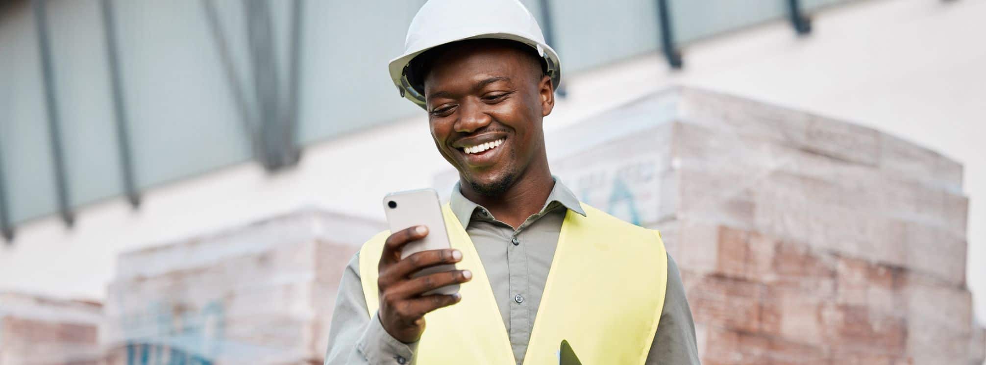 happy manufacturing employee using an employee experience app