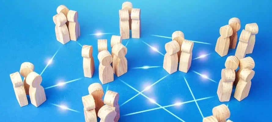 distributed teams connected together by glowing lines. Groups of wooden blocks all connected to one another.