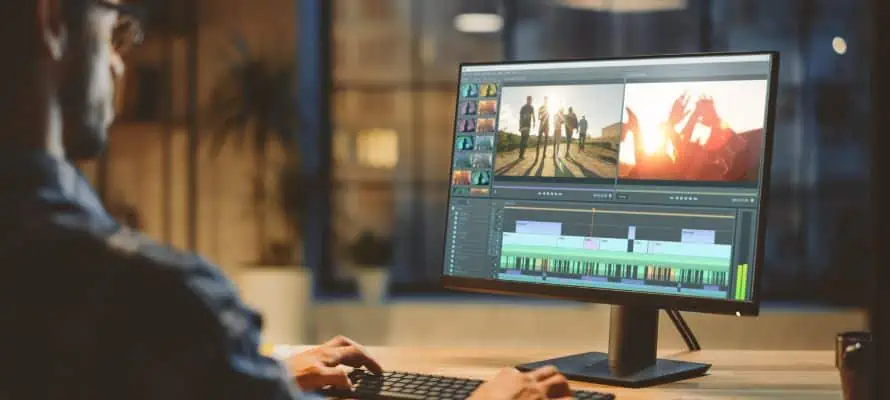 Man working on a desktop computer to edit an internal communication video