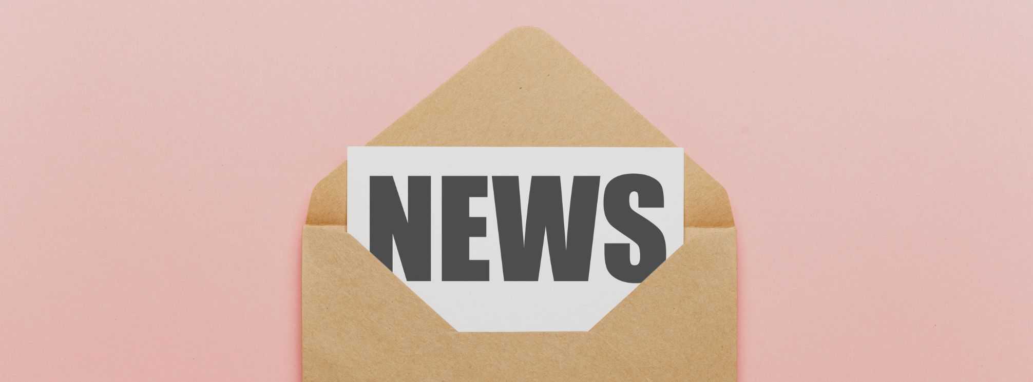Brown envelope on a pink background. Inside the envelope is a piece of paper that says "news."
