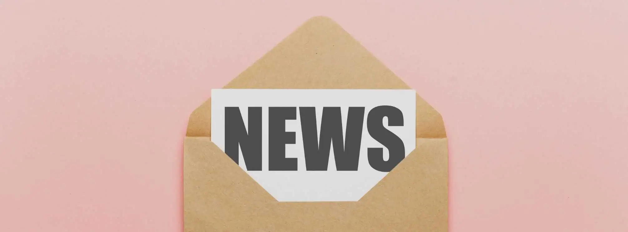 Brown envelope on a pink background. Inside the envelope is a piece of paper that says "news."