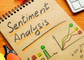 Pad of paper that says "sentiment analysis" with drawings of charts depicting employee sentiment.