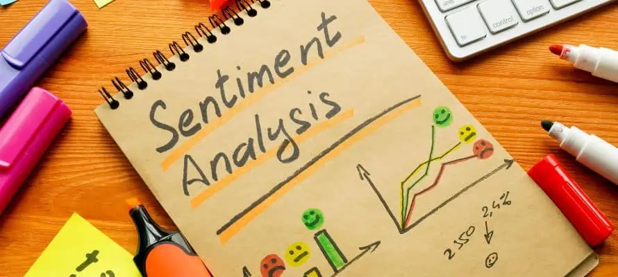 Pad of paper that says "sentiment analysis" with drawings of charts depicting employee sentiment.